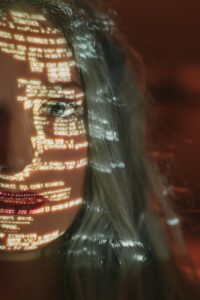 woman with text projected on her face